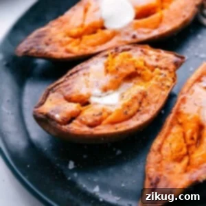 Freshly baked sweet potatoes with melting butter, captured from a delicious angle.