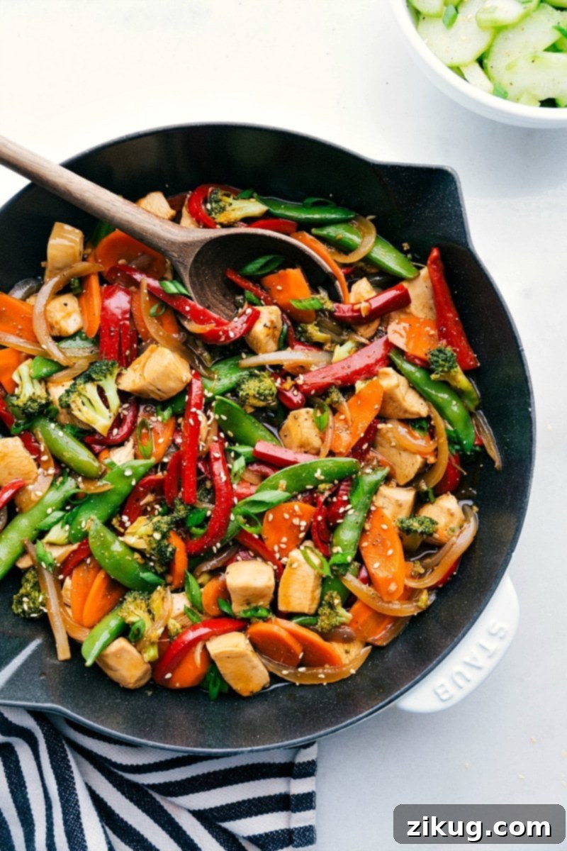 Chicken Stir Fry Ready to Serve - A Skillet Full of Flavor Chicken stir fry in a skillet, brimming with vegetables and rich flavors, prepared for serving.