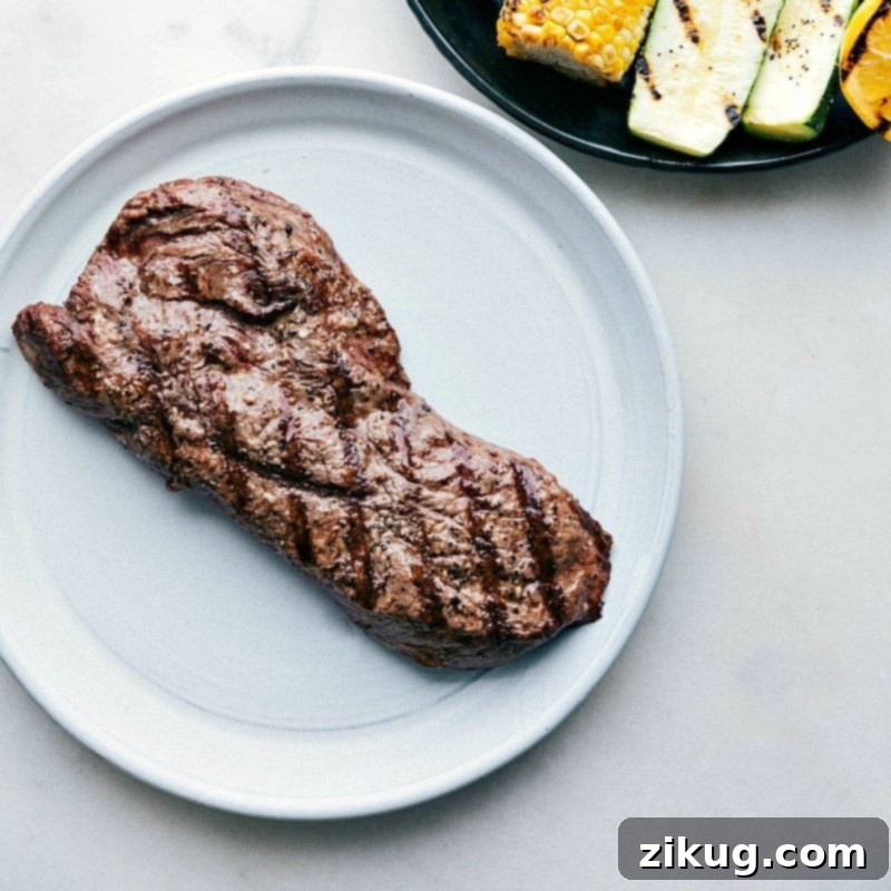 A perfectly grilled flat iron steak, just off the grill, showcasing the easiest and tastiest flat iron steak recipe for a delicious meal.