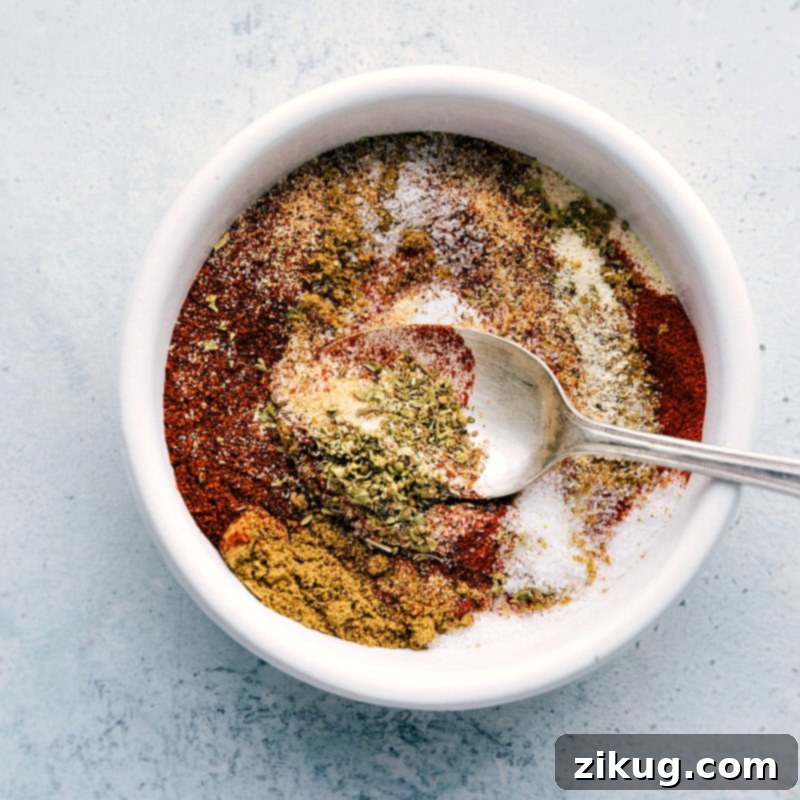 Crafting the Perfect Fajita Seasoning Blend A bowl filled with a mixture of seasonings and spices, being combined to create a flavorful seasoning blend for the shrimp fajita recipe.
