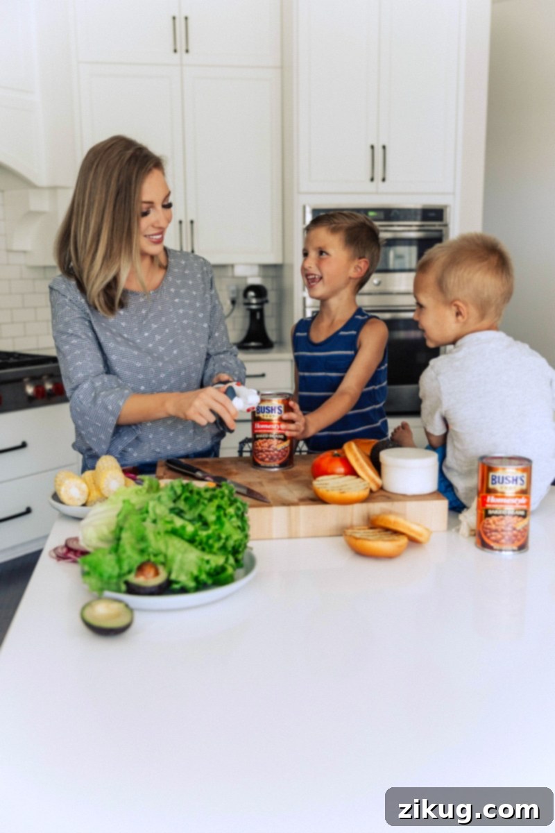 Family Meal Prep with Baked Beans Chelsea alongside her boys, opening a can of baked beans, preparing to serve them as a delicious side for their meal.
