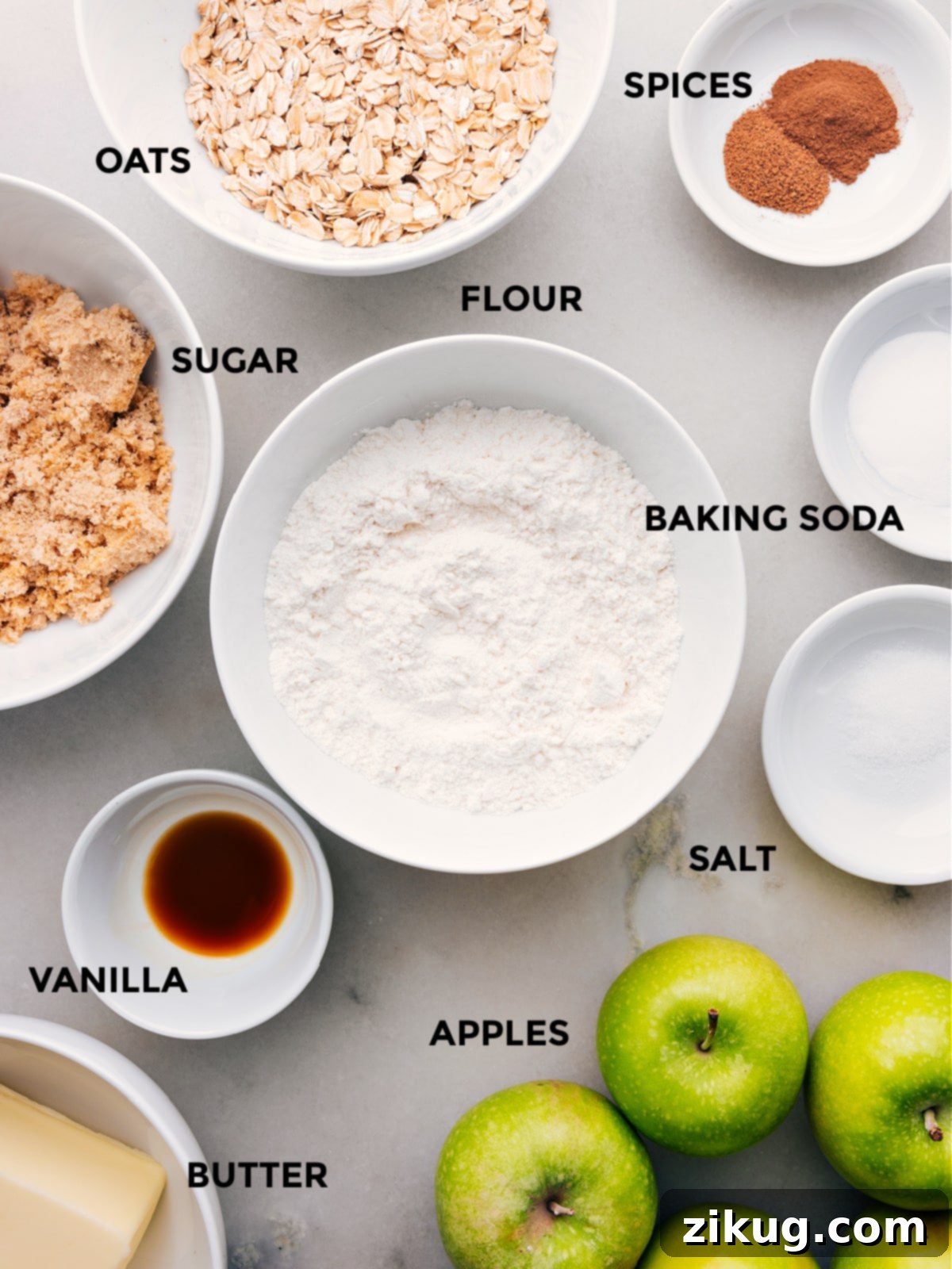 Essential Ingredients for Apple Pie Bars A collection of fresh, high-quality ingredients laid out for making Apple Pie Bars, including Granny Smith apples, butter, oats, and spices.