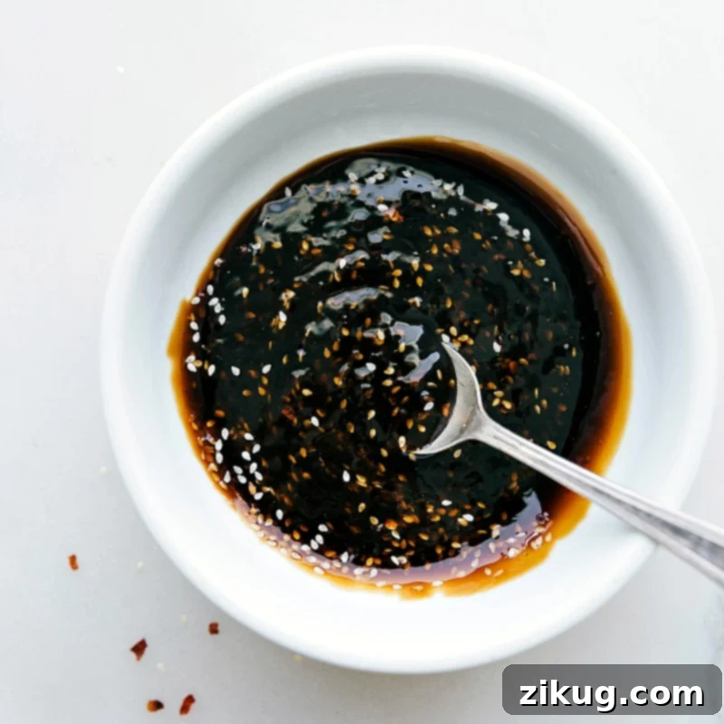 Homemade Teriyaki Sauce in a Bowl - Rich and Flavorful A bowl of rich, thick, and glossy homemade teriyaki sauce, ready to be used as a glaze or condiment.