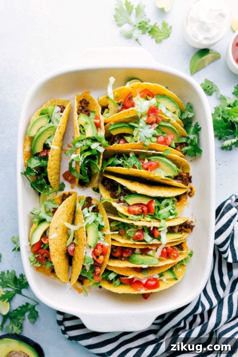 The delicious and finished beef taco recipe fresh out of the oven, topped with a variety of ingredients, creating the perfect meal.