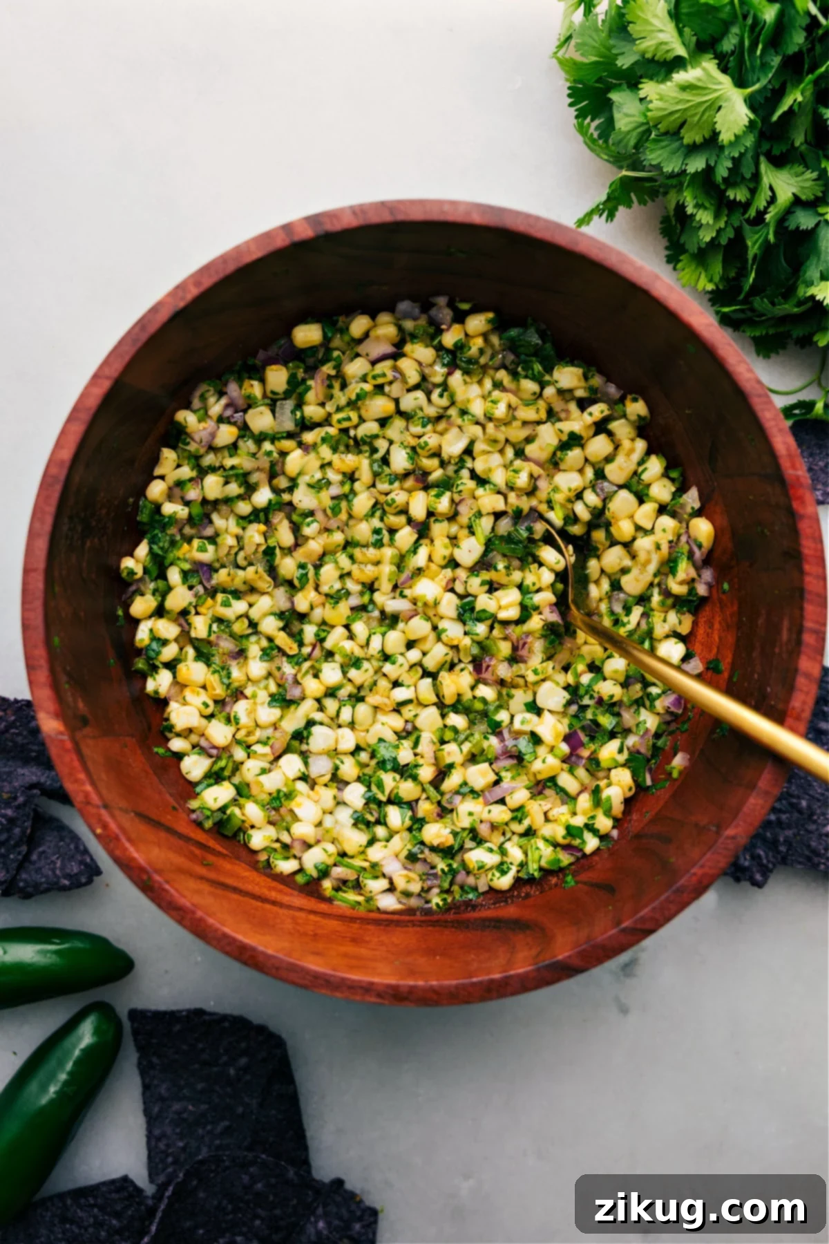 Chipotle Corn Salsa in a large bowl with spoon Chipotle Corn Salsa in a large bowl with spoon