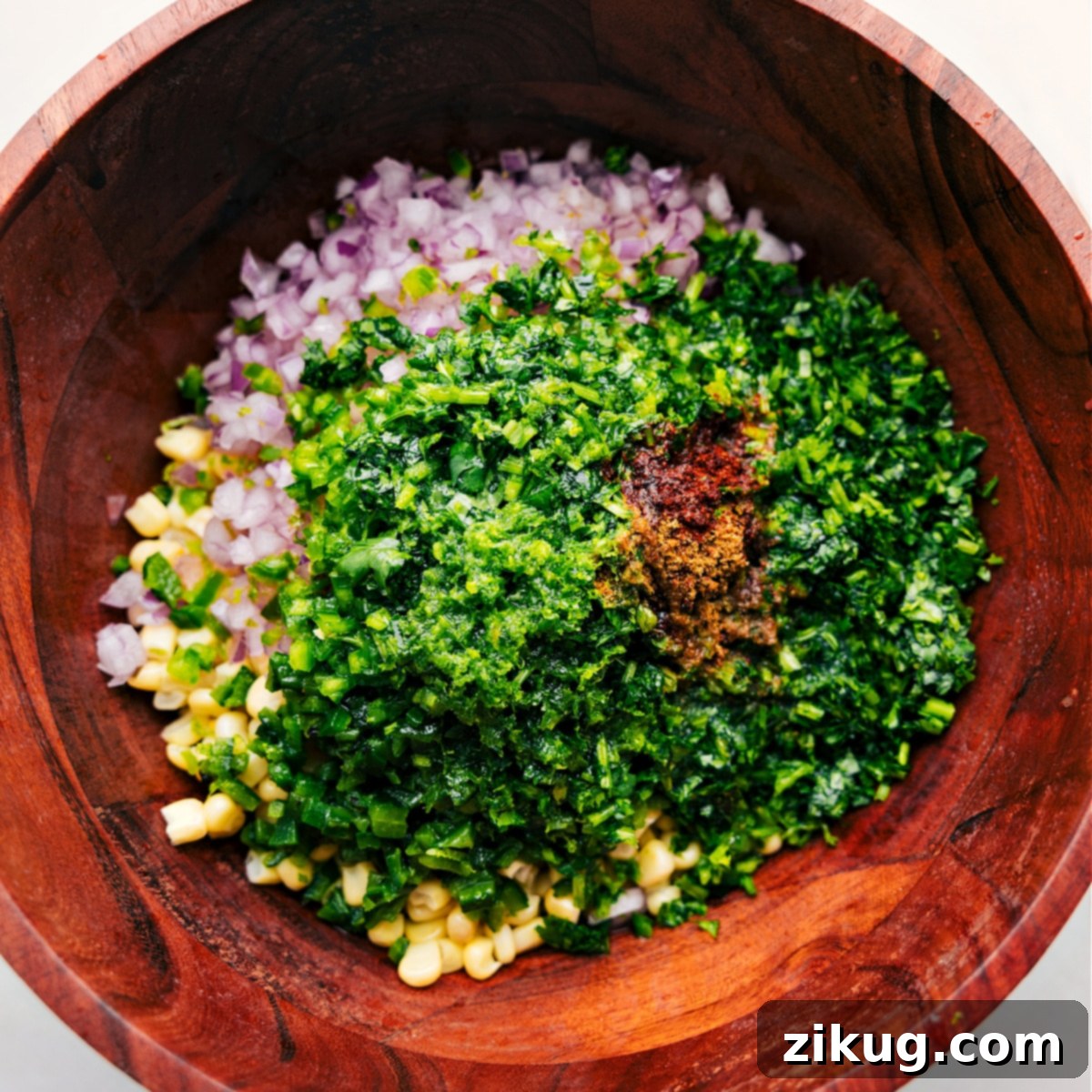 All the corn salsa recipe ingredients piled together in a bowl All the corn salsa recipe ingredients piled together in a bowl