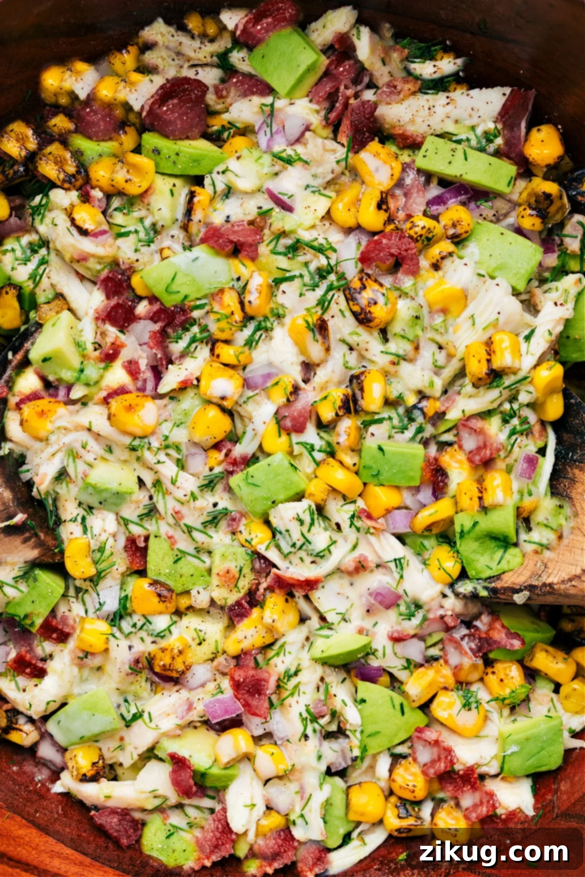 The Best Avocado Chicken Salad Recipe A bowl of freshly prepared Avocado Chicken Salad, tossed and ready to be served, showcasing its vibrant ingredients.