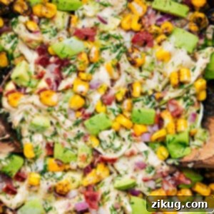 A serving of Avocado Chicken Salad in a bowl, garnished and ready to eat.