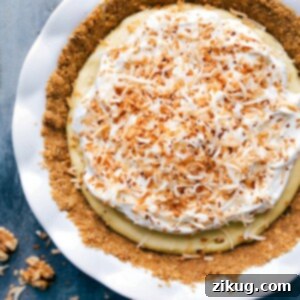 Delicious Coconut Cream Pie with whipped cream and toasted coconut.