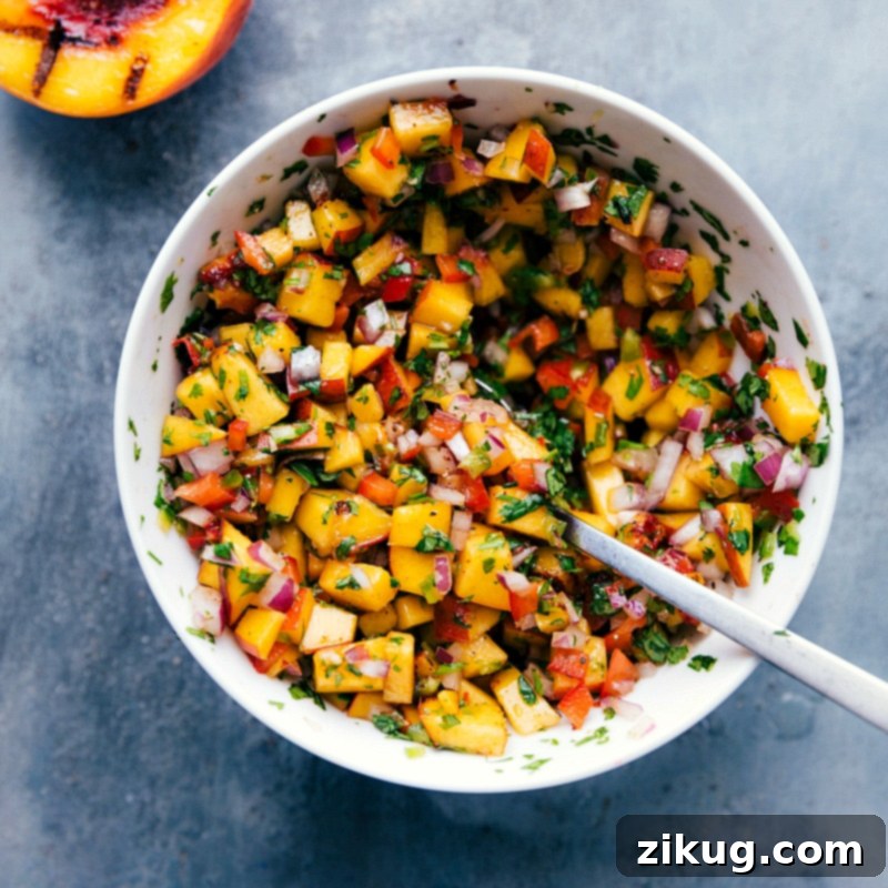 Bowl of Freshly Mixed Peach Salsa - Colorful and Flavorful Fresh and delicious chicken with peach salsa, with all ingredients mixed together in a bowl.