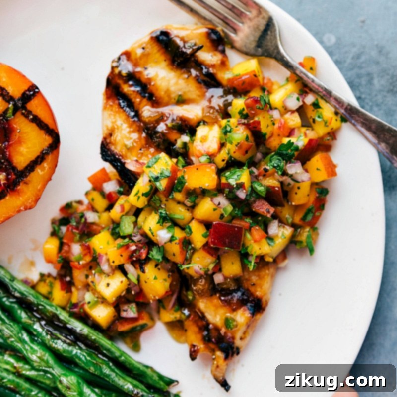 Grilled Chicken with Peach Salsa and Green Beans - A Tasty and Colorful Dish Delicious grilled chicken topped with peach salsa, served with green beans on the side.