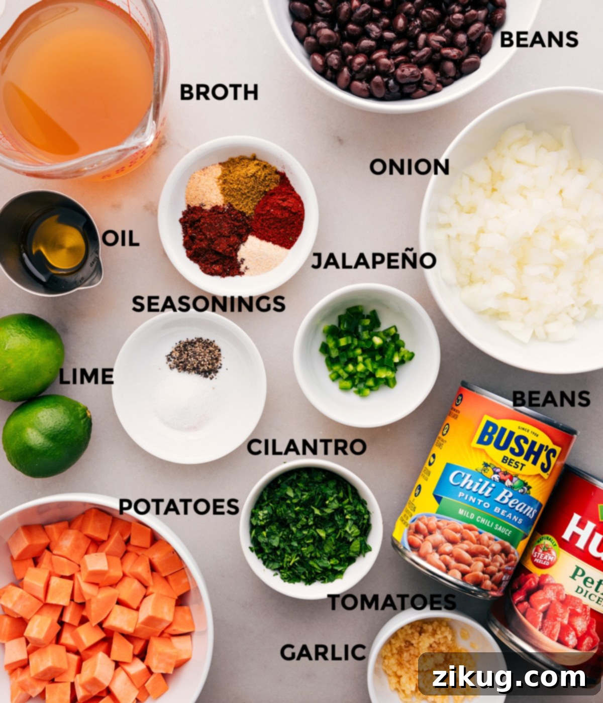 Ingredients In Sweet Potato Chili Recipe All the vibrant ingredients for Sweet Potato Chili, including fresh vegetables, spices, beans, broth, and tomatoes, neatly prepped for cooking.
