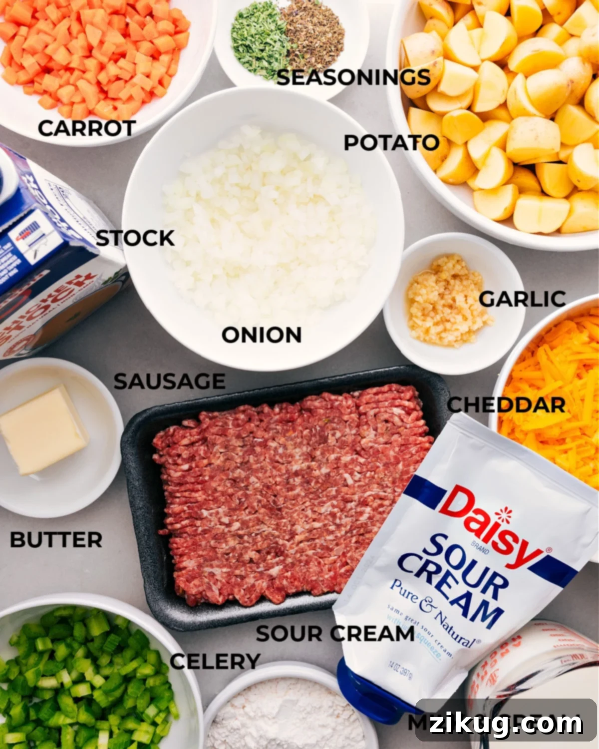 Ingredients In Sausage Potato Soup Recipe All the ingredients for this recipe are prepped, including potatoes, seasonings, veggies, meat, stock, butter, and sour cream, making assembly easy and efficient.