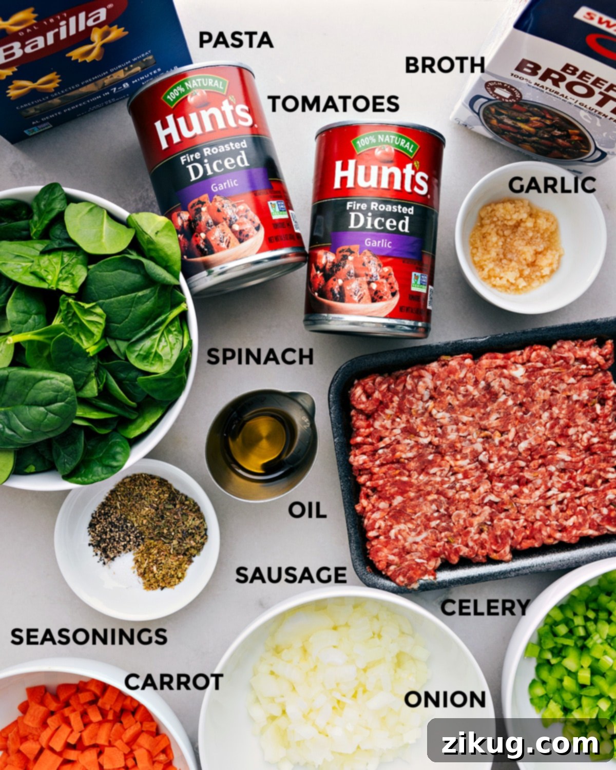 Key Ingredients for Delicious Pasta Soup All essential ingredients for Pasta Soup – including beef broth, fresh garlic, diced tomatoes, mini pasta, flavorful sausage, and vibrant spinach – meticulously prepped for seamless recipe execution.