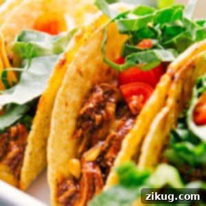 Close-up of a Rotisserie Chicken Taco, filled with delicious chicken and toppings.