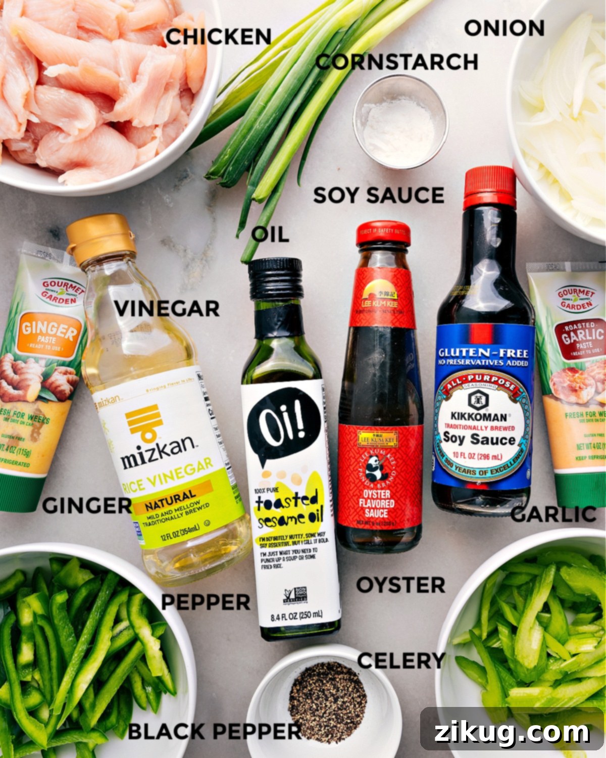 All the ingredients in this recipe prepped out for easy assembly including meat, cornstarch, onion, soy sauce, oil, vinegar, garlic, oyster sauce, rice vinegar, ginger, pepper, celery, and pepper.