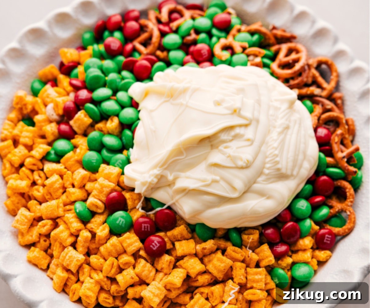 White Chocolate Christmas Snack Mix Pour the white chocolate over the dry ingredients.