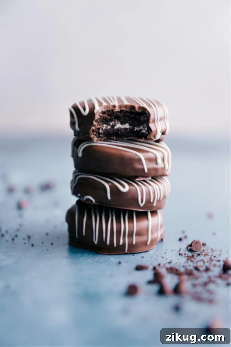 Stacked Chocolate Covered Oreos adorned with festive sprinkles, showcasing their rich chocolate coating and inviting appearance.