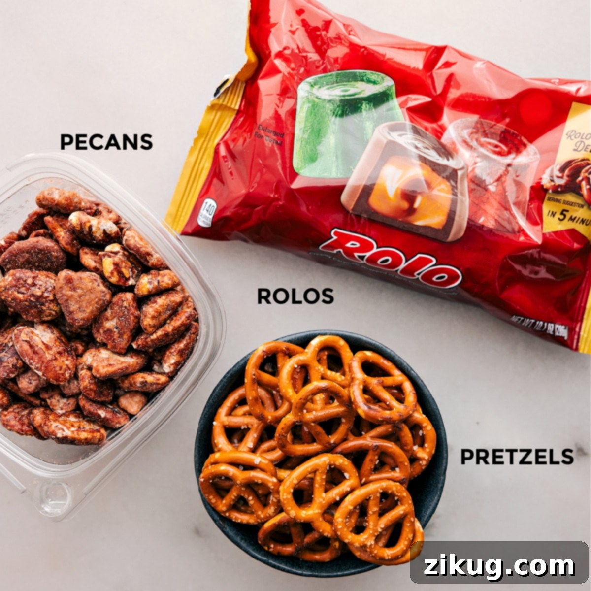 This recipe uses just 3 ingredients—Rolos, pretzels, and pecans—all prepped for easy assembly on a white background.