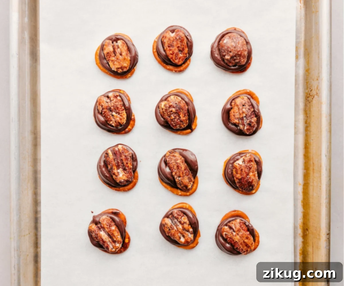 Fresh out of the oven, with pecans pressed right on top for these Rolo Pretzel Turtles, ready to cool.