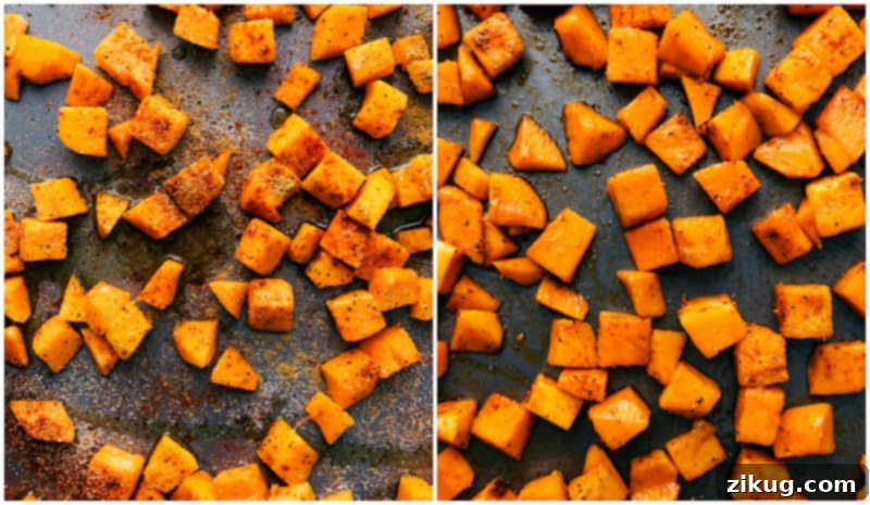 Process shot showing cubed butternut squash seasoned with spices on a baking sheet, ready for roasting.