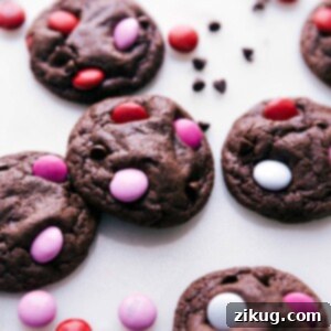 Freshly baked cookies adorned with colorful Valentine's M&M's.