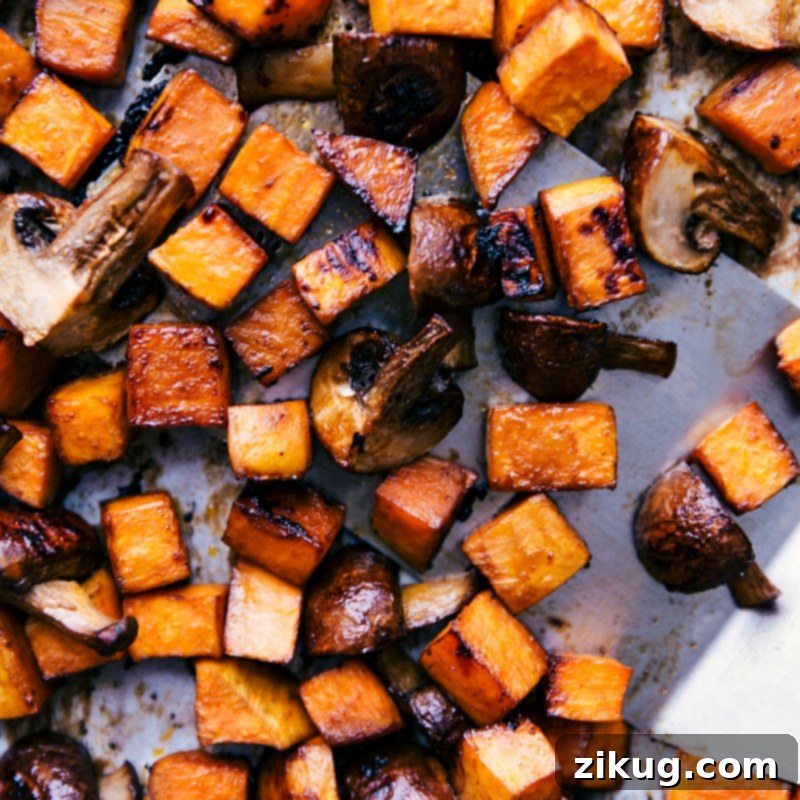Perfectly Roasted Sweet Potato and Mushroom Filling for Vegetarian Lettuce Wraps Freshly roasted sweet potatoes and mushrooms glistening with a savory glaze, hot and ready for the wraps.