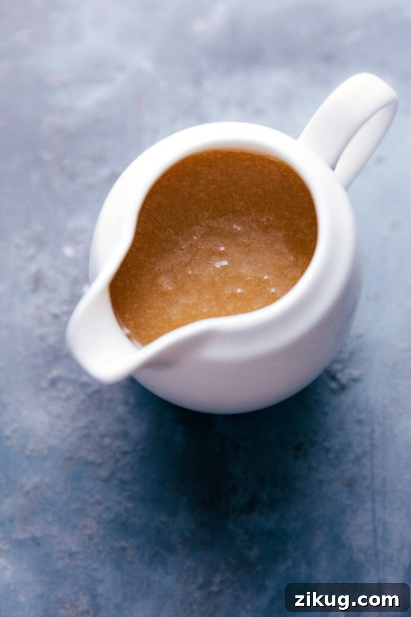 Ready-to-Serve Creamy Buttermilk Syrup in Container Container filled with creamy buttermilk syrup, with a silky texture, ready to be poured over your favorite breakfast dishes.