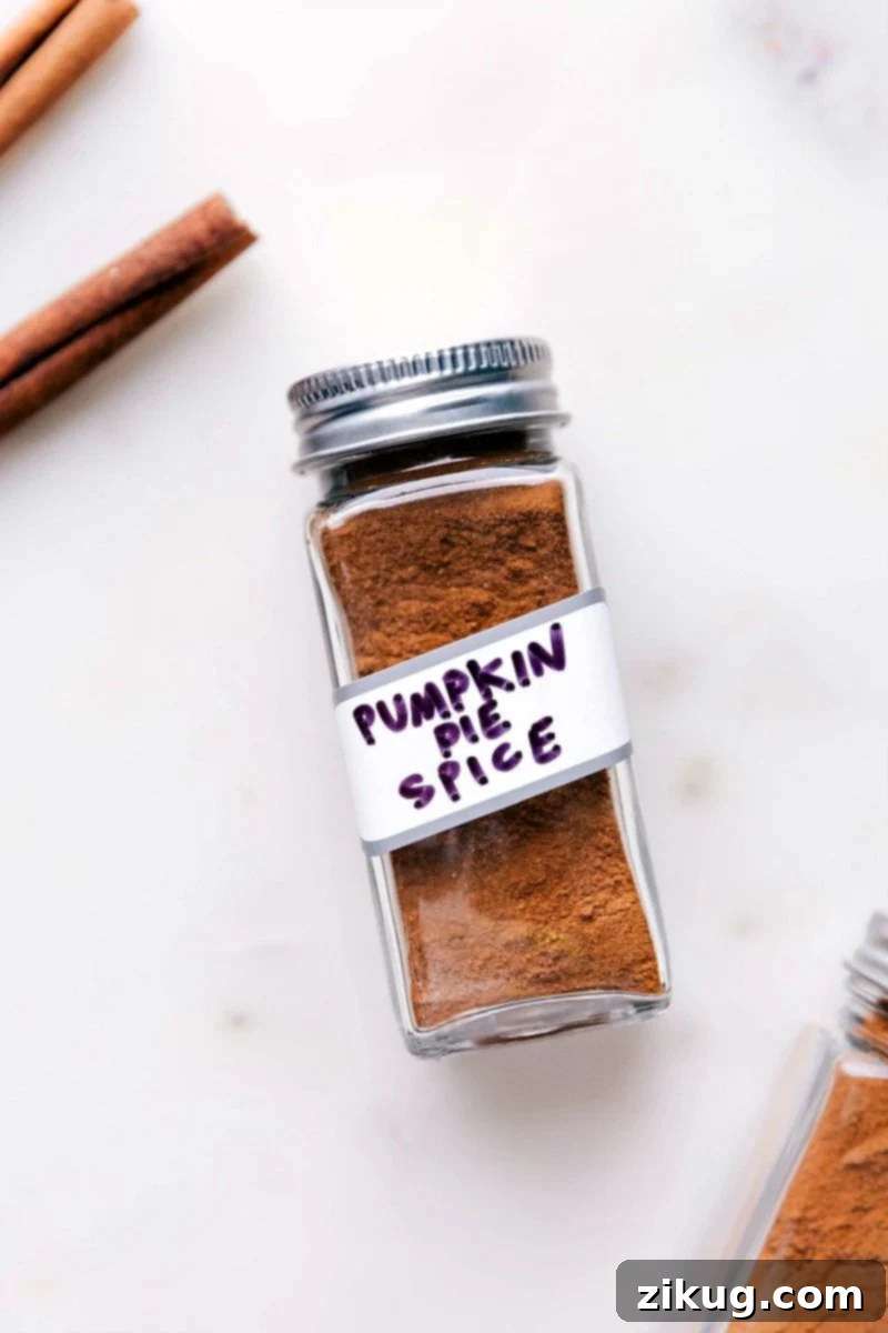Essential Homemade Pumpkin Pie Spice Blend A charming jar filled with aromatic homemade pumpkin pie spice, ready for fall recipes and baking projects.