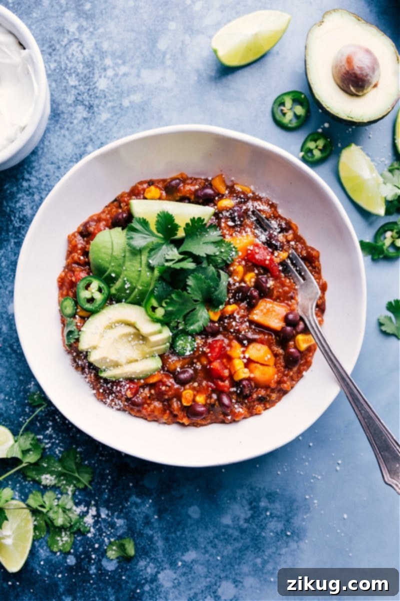 A vibrant bowl of Slow Cooker Mexican Quinoa, topped with fresh cilantro and a dollop of sour cream, showcasing its hearty and delicious appeal.