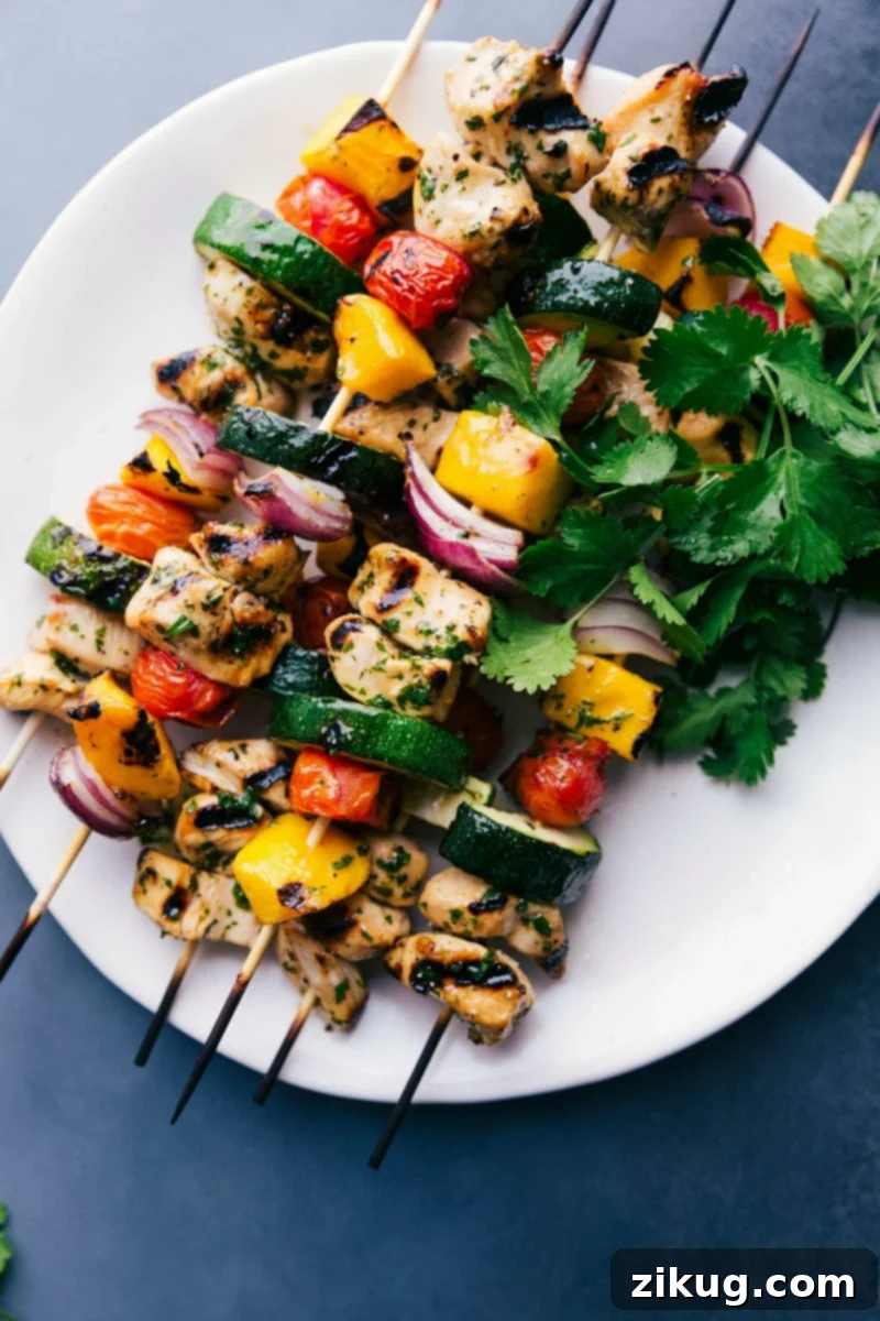 Delicious Chicken Kabobs: Grilled and Ready to Enjoy Gorgeous, vibrant chicken kabobs on a plate, grilled, and ready to eat.