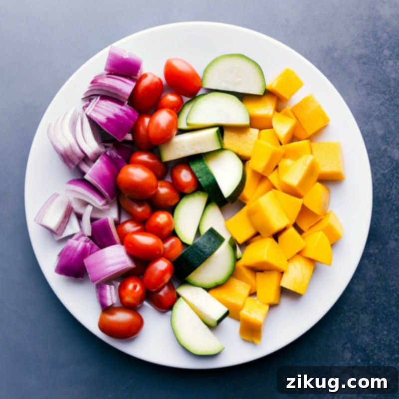 Fresh and Vibrant Ingredients for Grilling Bright, vibrant, fresh fruit and vegetables on a plate before being grilled.