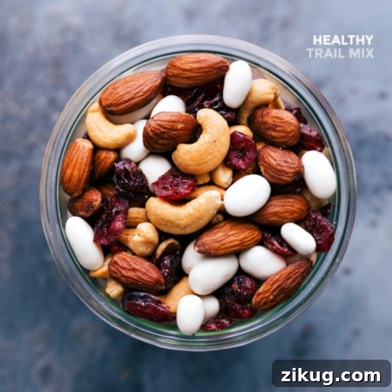 A completed snack, showcasing a vibrant blend of nuts, seeds, and dried fruits, perfectly arranged and ready for healthy snacking.