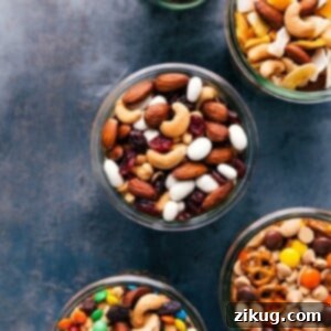 A vibrant bowl of homemade trail mix, showcasing a delightful blend of nuts, dried fruits, and chocolate, ready to be enjoyed.