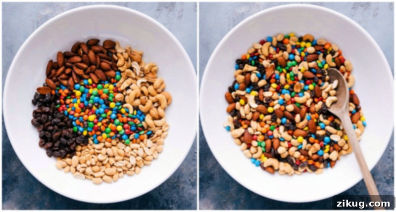 Ingredients for mountain trail mix, featuring colorful M&M's, sunflower seeds, chocolate-covered popcorn, dark chocolate chunks, and pecans, being stirred together in a bowl.