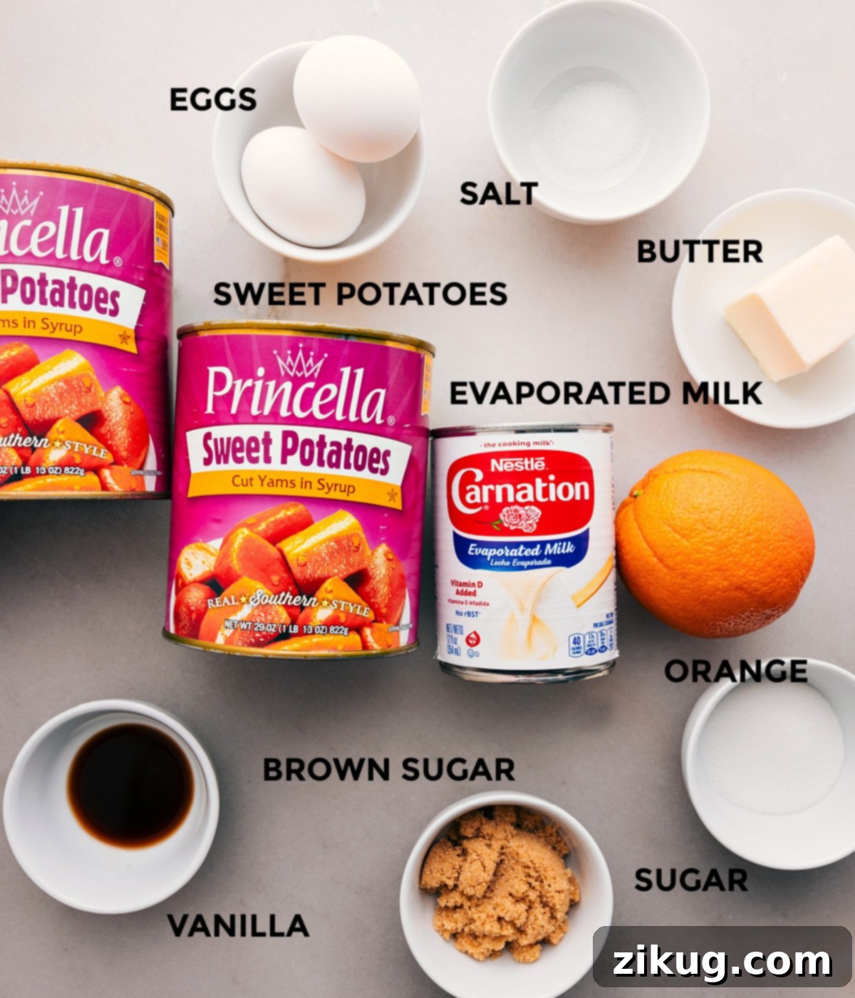 Key Ingredients For Crockpot Sweet Potato Casserole All the essential ingredients for Crockpot Sweet Potato Casserole laid out: canned sweet potatoes, softened butter, white sugar, brown sugar, fresh orange juice, eggs, vanilla extract, and evaporated milk.