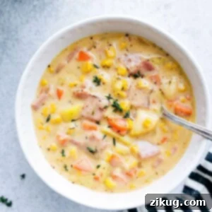 A hearty, inviting bowl of soup, steaming and ready to be enjoyed.