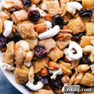 A top-down view of the delicious Dried Cherry Snack Mix, featuring a mix of cereals, nuts, and vibrant dried tart cherries.