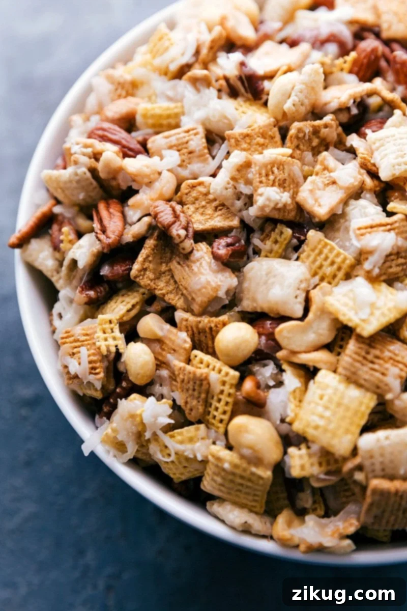 Sweet Chex Mix with Ingredients Coated in Sugar Sauce Completed sweet chex mix recipe displaying all ingredients thoroughly coated in delicious sugar sauce.