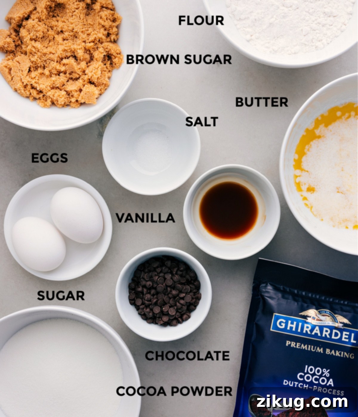 All the essential ingredients—butter, salt, flour, eggs, vanilla, cocoa powder, chocolate, and sugar—neatly prepped for making brownies.