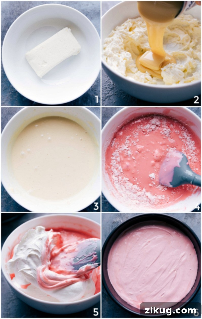 Crafting the Creamy Filling for Easy No-Bake Peppermint Cheesecake Close-up of a creamy, pale pink peppermint cheesecake filling being whipped in a bowl, showing its smooth texture and subtle color.