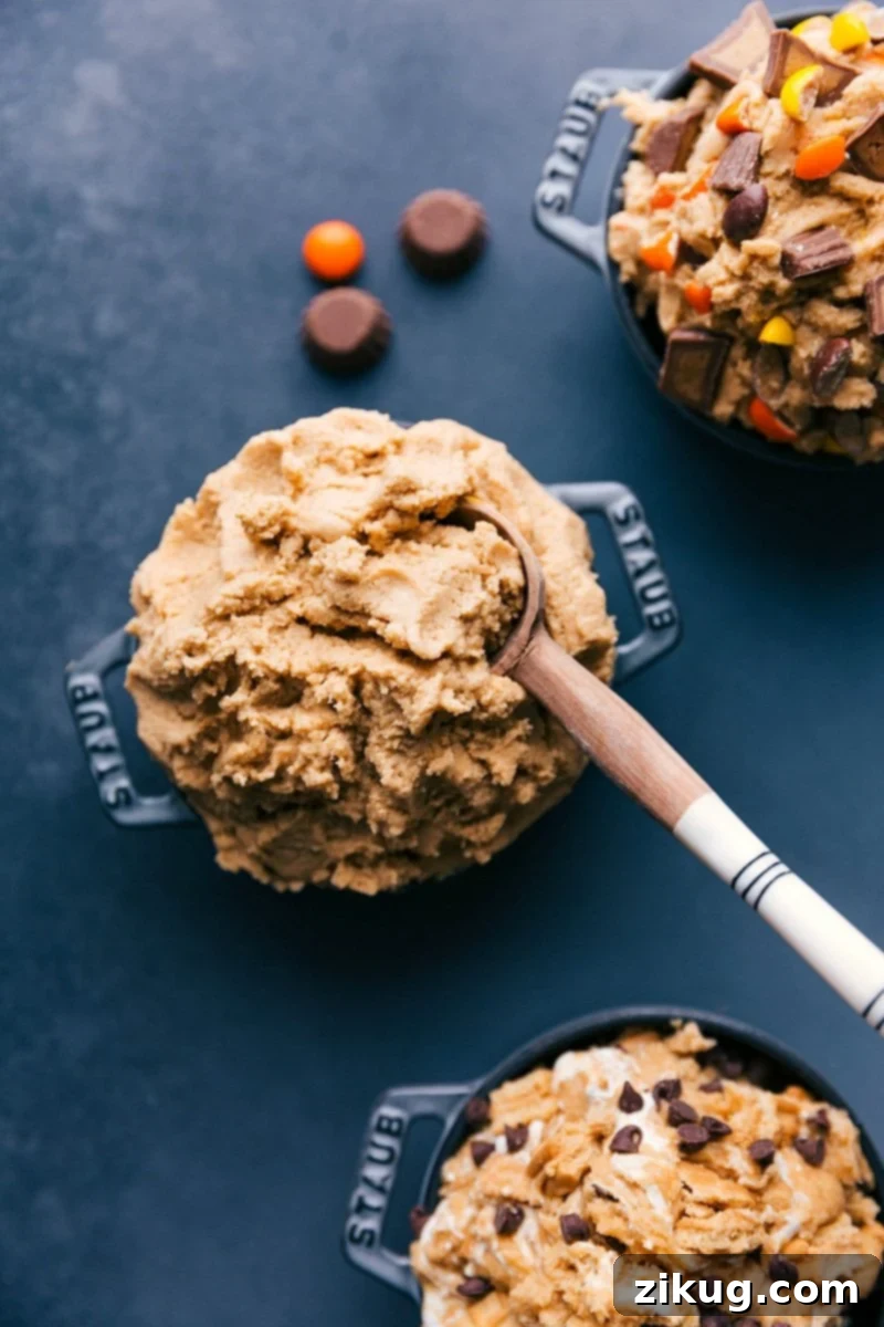 Spoonful of Irresistible Edible Peanut Butter Cookie Dough Delight A beautifully presented bowl of creamy edible peanut butter cookie dough, accompanied by a spoon, signifying it's ready for an indulgent serving. The texture appears smooth and inviting.