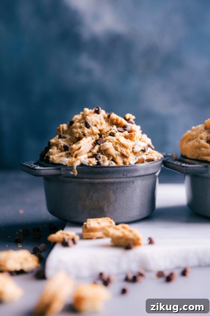 Dig into Delicious Edible Peanut Butter Cookie Dough A vibrant bowl of edible peanut butter cookie dough, rich in its golden-brown hue and perfectly smooth texture, inviting a delicious taste.