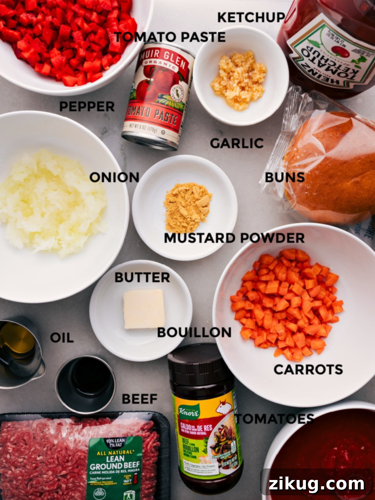Preparing Sloppy Joe: From Veggies to Beef to Seasoning All the essential ingredients for this Sloppy Joes recipe—fresh onions, bell peppers, carrots, garlic, quality ground beef, tomato paste, crushed tomatoes, ketchup, Worcestershire sauce, brown sugar, ground mustard, beef bouillon, and pepper—are prepped and laid out, ready for easy assembly and cooking.