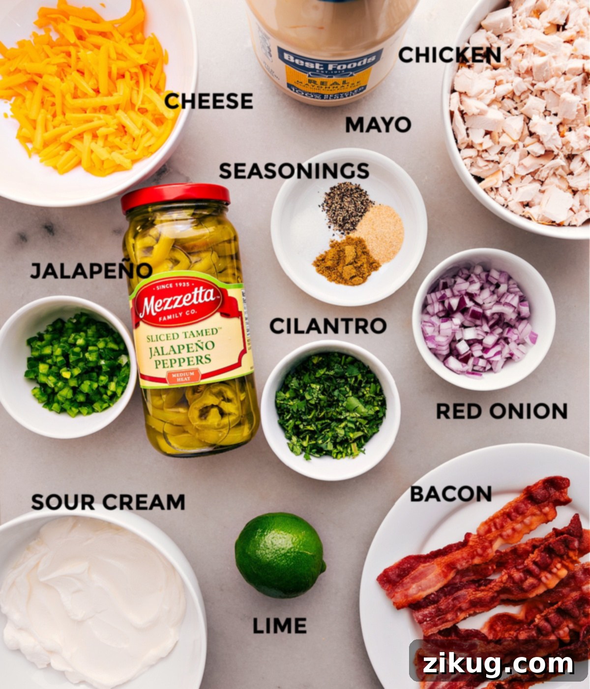 Ingredients In Jalapeño Popper Chicken Salad All the essential ingredients for this delicious Jalapeño Popper Chicken Salad are prepped and ready for easy assembly: cheese, mayo, sour cream, various seasonings, fresh and jarred jalapeños, red onion, cilantro, and tender chicken.