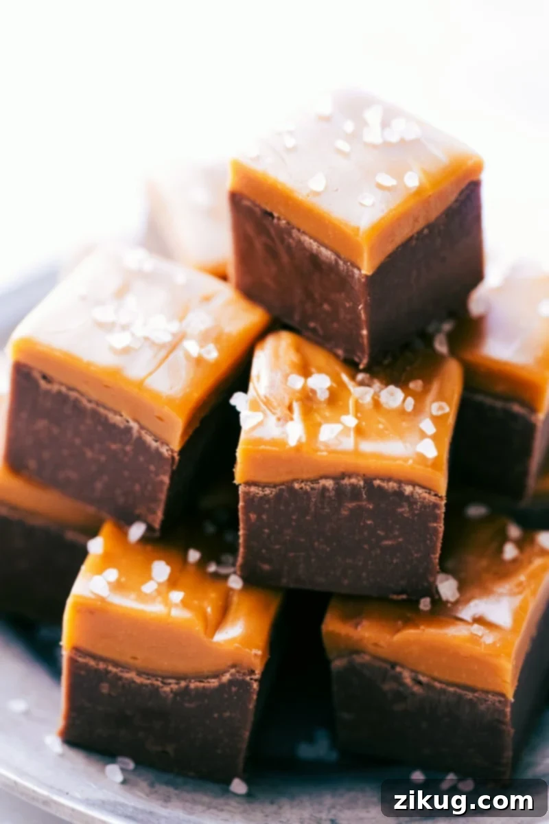 Simple Microwave Fudge Recipe Delightful squares of rich, creamy Microwave Fudge stacked on a plate, ready to be enjoyed.