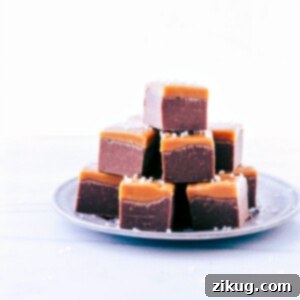 Effortless Microwave Fudge 3 Delicious Microwave Fudge cut into perfect cubes and elegantly stacked on a plate.