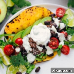 A bowl of delicious shredded beef tacos with vibrant toppings.