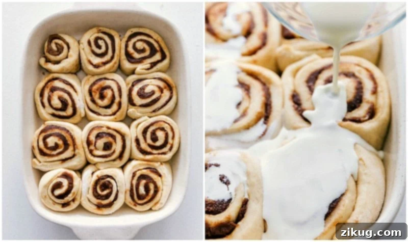 Adding the secret ingredient: heavy cream for ultimate gooeyness. A hand pouring warmed heavy cream over the risen homemade cinnamon rolls in a baking pan, adding the secret ingredient for extra gooeyness.