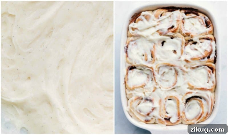 Frosting warm homemade cinnamon rolls. Process shot of creamy white frosting being generously spread over a pan of warm, freshly baked Homemade Cinnamon Rolls.